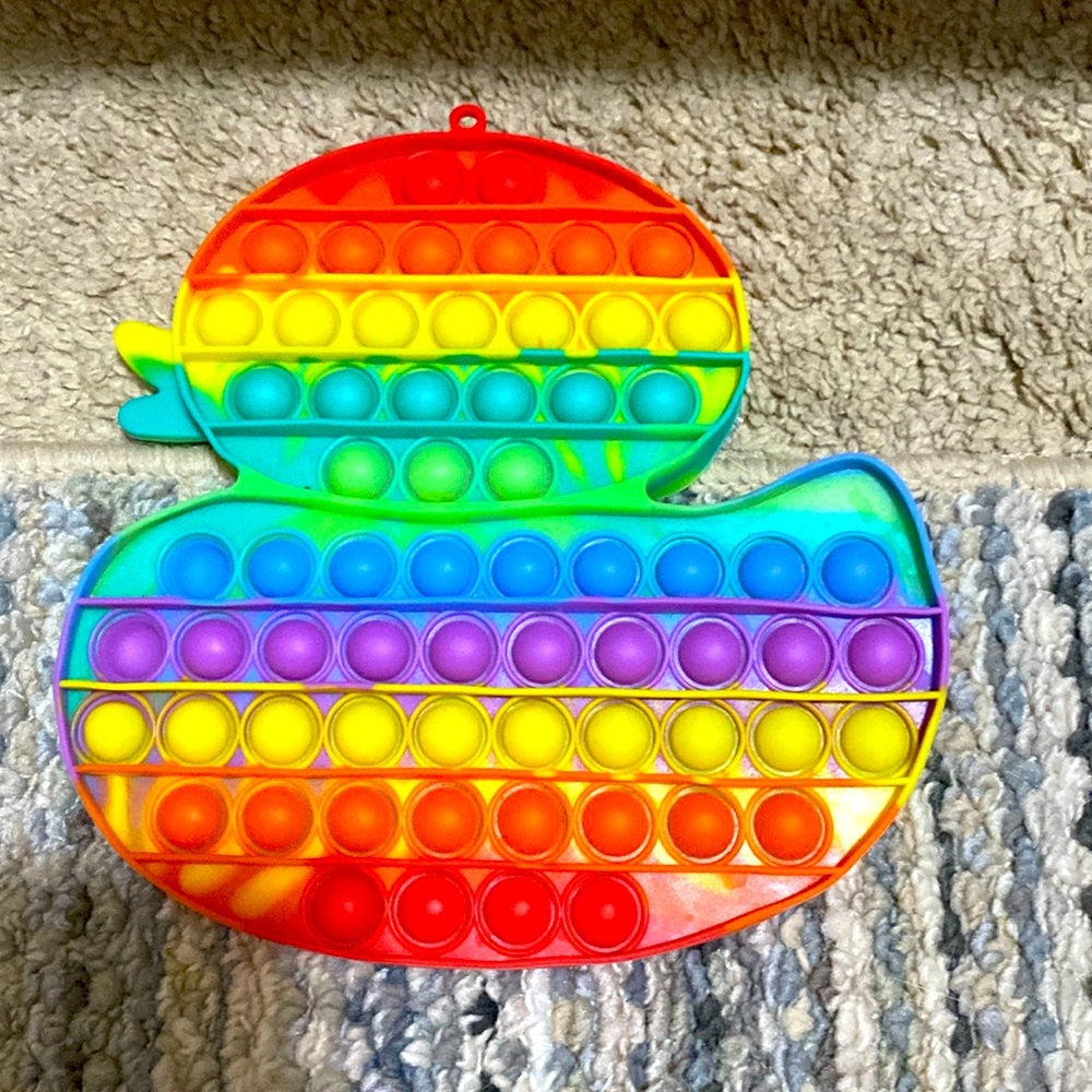 This is a multicolored duck pop-it sensory toy